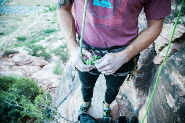 Someone getting ready to climb rocks